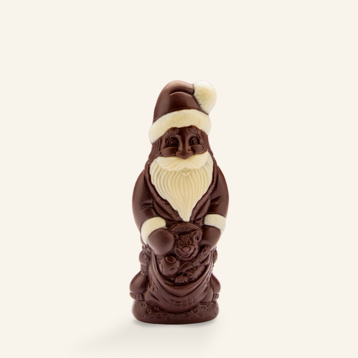 Handwerklicher dunkler Weihnachtsschokoladenmann mit weißen Details und Nikolausmütze. - Rausch