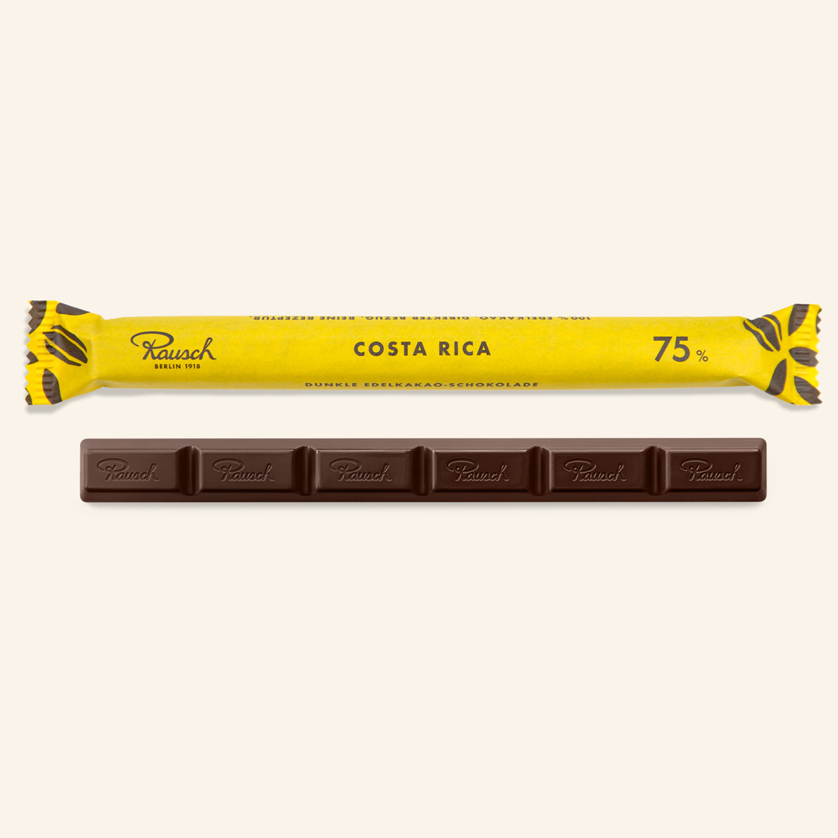 Dunkle Schokolade in fünf rechteckigen Stücken, gelbe Verpackung mit schwarzem Text „Costa Rica 75%“. - Rausch