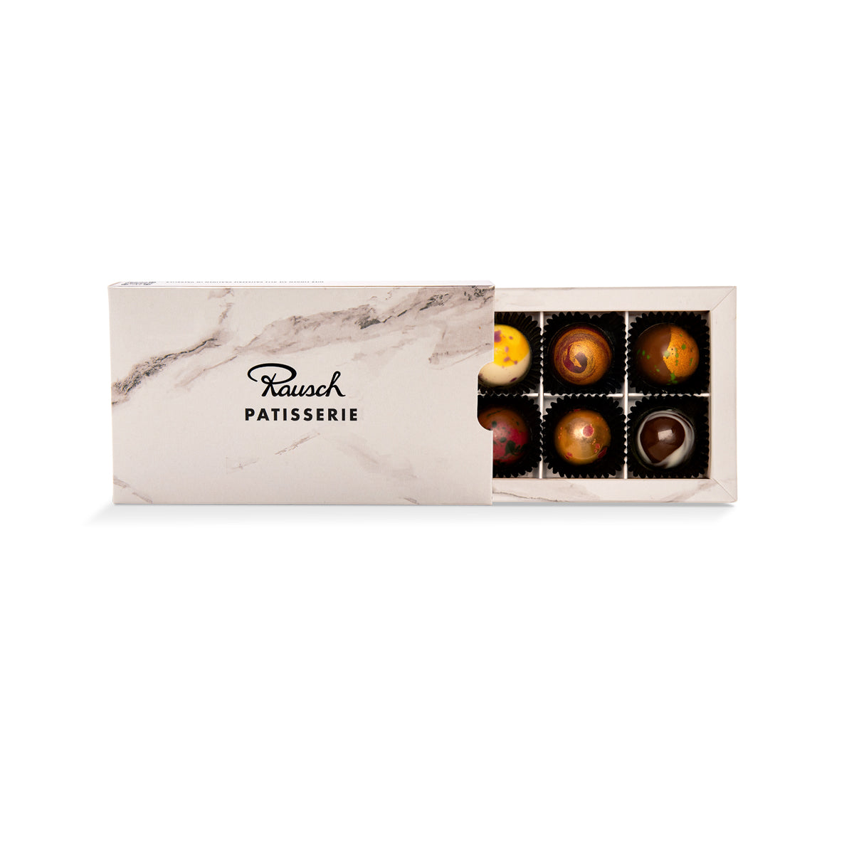 Edle handwerkliche Pralinen in verschiedenen Schokoladenfarben in eleganter Box. - Rausch