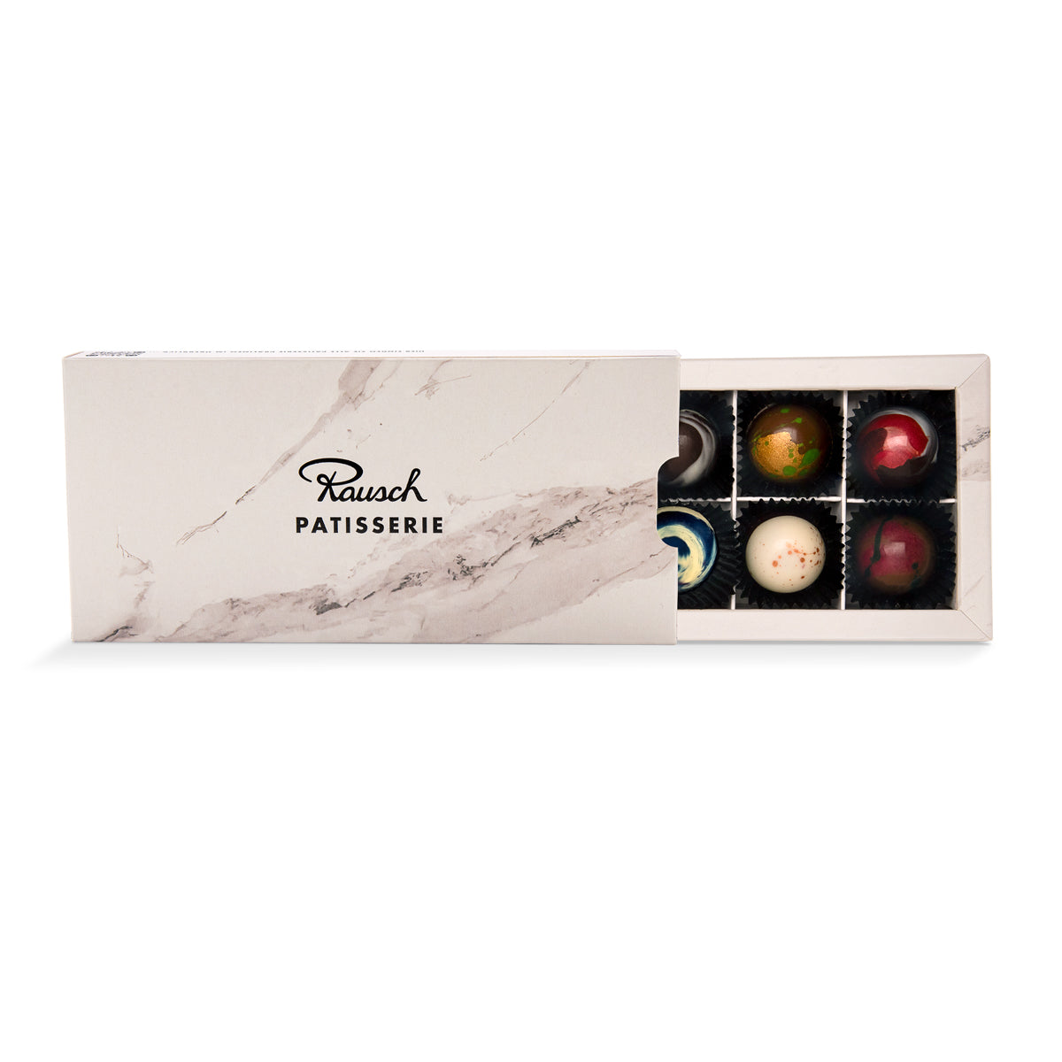 Geöffnete Box mit 10 handgemachten Patisserie Pralinen in verschiedenen Farben und Formen. - Rausch