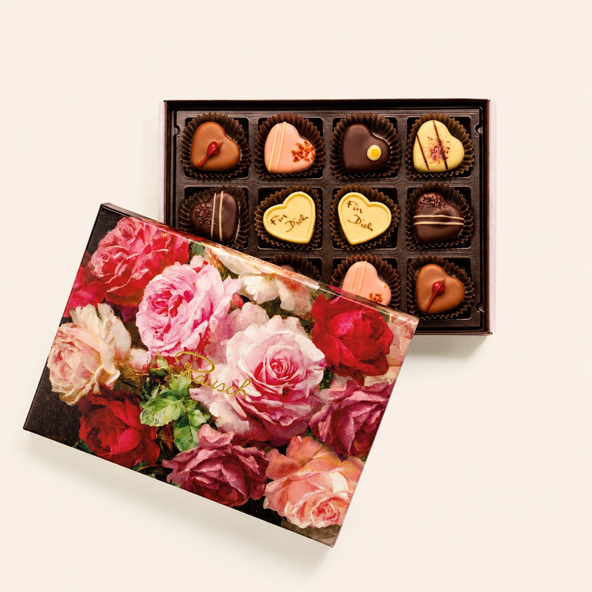 Pralinenkiste mit 12 handwerklichen Schokoladen, Herzform, bunte Rosen auf Deckel. - Rausch