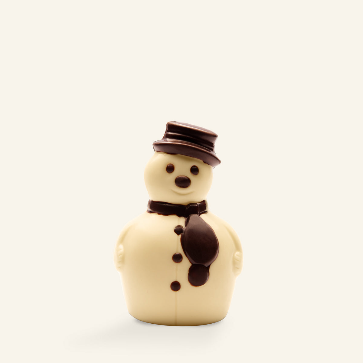 Handwerklich gefertigte weiße Schokoladen-Schneemannfigur mit dunkler Schokoladenmütze und Schal. - Rausch
