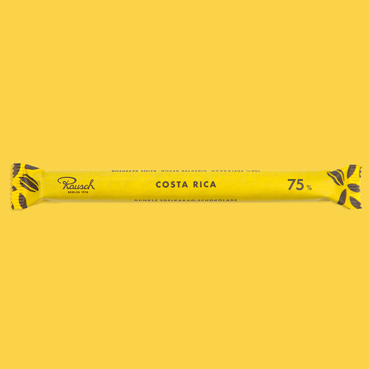 Gelbe handwerkliche Schokoladenstange mit schwarzer Schrift "Costa Rica 75%". - Rausch